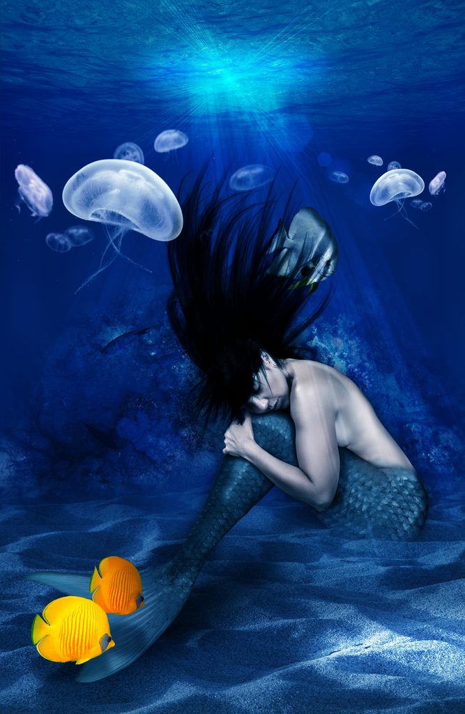 mermaid in blue ocean